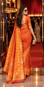 Premium Dola Silk Bandhani Print Zari Border Sarees With Unstitched Blouse(Orange)